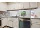 This renovated kitchen features stainless steel appliances and granite countertops at 1647 Imperial Ct, Norcross, GA 30093