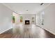 Bright living room featuring a cozy fireplace, hardwood floors, and plenty of natural light at 1647 Imperial Ct, Norcross, GA 30093