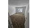 Simple bedroom with carpet flooring, a window, and neutral wall paint at 173 Amherst Nw Pl, Atlanta, GA 30327