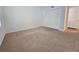 Simple bedroom with carpet flooring, a window, and a closet at 173 Amherst Nw Pl, Atlanta, GA 30327