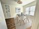 Bright dining room with modern decor, including art and an updated light fixture at 173 Amherst Nw Pl, Atlanta, GA 30327