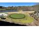 Putting green and golf course with pond create an idyllic scene at 173 Amherst Nw Pl, Atlanta, GA 30327