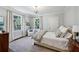 Inviting bedroom features soft blue walls, natural light, hardwood floors, and classic furnishings at 3114 Peachtree Ne Dr, Atlanta, GA 30305