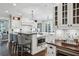 Modern kitchen featuring white cabinets, a center island, and stainless-steel appliances at 3114 Peachtree Ne Dr, Atlanta, GA 30305