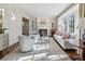 Bright living room featuring large windows, a fireplace, and classic decor at 3114 Peachtree Ne Dr, Atlanta, GA 30305