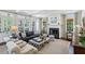 Spacious living room with fireplace, French doors, and an abundance of natural light at 3114 Peachtree Ne Dr, Atlanta, GA 30305