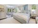 Serene main bedroom featuring a sitting area with large windows offering views of the surrounding greenery at 3114 Peachtree Ne Dr, Atlanta, GA 30305