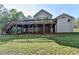 View of the two-level rear wood deck and expansive green backyard at 3211 Thompson Mill Rd, Buford, GA 30519