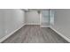 Unfinished basement with hardwood flooring and gray walls at 3211 Thompson Mill Rd, Buford, GA 30519