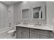 Stylish bathroom with double vanity, framed mirrors, and a tub-shower combo, showcasing modern design at 3211 Thompson Mill Rd, Buford, GA 30519