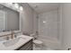 Bathroom with white cabinets, tiled shower walls and floors at 3211 Thompson Mill Rd, Buford, GA 30519