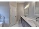 Modern bathroom features double sinks, marble floors, and a large mirror at 3211 Thompson Mill Rd, Buford, GA 30519