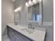 The primary bathroom includes a double sink vanity and a large mirror at 3211 Thompson Mill Rd, Buford, GA 30519