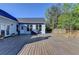 Expansive wooden deck with beautiful views of the yard and surrounding trees at 3211 Thompson Mill Rd, Buford, GA 30519