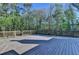 This is an image of a wooden back deck with trees in the background at 3211 Thompson Mill Rd, Buford, GA 30519