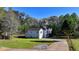 Well-maintained home with landscaped yard and long private driveway at 3211 Thompson Mill Rd, Buford, GA 30519