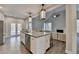A spacious kitchen features stainless steel appliances, a large island, and lots of natural light at 3211 Thompson Mill Rd, Buford, GA 30519