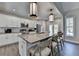 This modern kitchen boasts an oversized island, stainless appliances, and ample cabinet space at 3211 Thompson Mill Rd, Buford, GA 30519