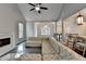 Inviting living room features a fireplace and an open layout adjacent to the dining area and staircase at 3211 Thompson Mill Rd, Buford, GA 30519