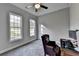 Bright office with large windows, chair, and desk at 3211 Thompson Mill Rd, Buford, GA 30519