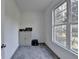 Neutral room with natural light, featuring a closet and a large window with backyard views at 3211 Thompson Mill Rd, Buford, GA 30519