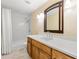 Bathroom featuring white herringbone tile in shower and oak vanity with white countertop at 5400 Roswell Rd # J2, Atlanta, GA 30342