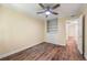 Bedroom features wood-look floors, fan, and built-in shelving at 5400 Roswell Rd # J2, Atlanta, GA 30342