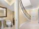 Hallway view to the staircase, bathroom, and doorway to the outside, decorated with a mirror and artwork at 5400 Roswell Rd # J2, Atlanta, GA 30342