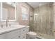 Elegant bathroom featuring a glass-enclosed shower, modern vanity, and sleek fixtures at 1021 Magnolia Se Dr, Smyrna, GA 30082