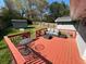 Red stained deck with patio furniture for outdoor enjoyment at 1021 Magnolia Se Dr, Smyrna, GA 30082