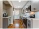 Beautiful renovated kitchen featuring stainless steel appliances, modern cabinets and hardwood floor at 1021 Magnolia Se Dr, Smyrna, GA 30082