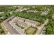 Aerial view of townhomes with private garages, surrounded by lush greenery and convenient street access at 1983 Silver Birch Se Dr, Smyrna, GA 30080