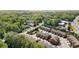 Aerial view showcasing a community of townhomes surrounded by lush greenery and convenient access to the highway at 1983 Silver Birch Se Dr, Smyrna, GA 30080