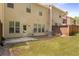 Backyard with grass, a patio, privacy fence, and the exterior of a home at 1983 Silver Birch Se Dr, Smyrna, GA 30080