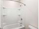 Bright bathroom featuring a shower and tub combination with built-in shelving at 1983 Silver Birch Se Dr, Smyrna, GA 30080