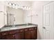 Bathroom featuring double vanity with granite countertop and tiled flooring at 1983 Silver Birch Se Dr, Smyrna, GA 30080