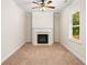 Cozy bedroom with a fireplace, carpeted flooring, and a window providing natural light at 1983 Silver Birch Se Dr, Smyrna, GA 30080