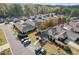 A bird's eye view showcasing the homes in the community, landscaping, and parking area at 307 Jessica Way, Canton, GA 30114