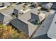 A bird's eye view showing the home's backyard, covered patio, and neighboring properties at 307 Jessica Way, Canton, GA 30114