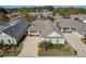 An aerial view of the home showcasing landscaping, driveway, and attached two-car garage at 307 Jessica Way, Canton, GA 30114
