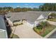 An aerial view of the home showcasing the driveway, landscaping, and attached two-car garage at 307 Jessica Way, Canton, GA 30114