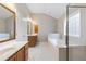 Spacious bathroom features double vanity, walk-in shower, and soaking tub at 307 Jessica Way, Canton, GA 30114