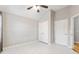 Bright bedroom featuring an updated ceiling fan and lots of closet space at 307 Jessica Way, Canton, GA 30114