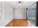 Bedroom with wood floors, big windows, and slider door to patio at 307 Jessica Way, Canton, GA 30114
