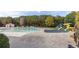 Expansive community pool area with a splash pad, covered pools, and a thrilling waterslide for Gathering fun at 307 Jessica Way, Canton, GA 30114