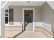 Front entryway with brick accents and neutral exterior paint at 307 Jessica Way, Canton, GA 30114