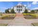 Charming two-story home with a grand front porch, manicured landscaping, and a welcoming entrance at 307 Jessica Way, Canton, GA 30114