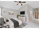 Well-lit main bedroom showcases modern ceiling fan and accent wall at 307 Jessica Way, Canton, GA 30114