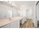 Large bathroom vanity with double sinks, a dressing area, and entry to the shower and closet at 3858 Vineyards Lake Nw Cir # U-19, Kennesaw, GA 30144