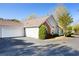Single-Gathering home displaying a large driveway, two-car garage, and well-manicured front yard at 3858 Vineyards Lake Nw Cir # U-19, Kennesaw, GA 30144